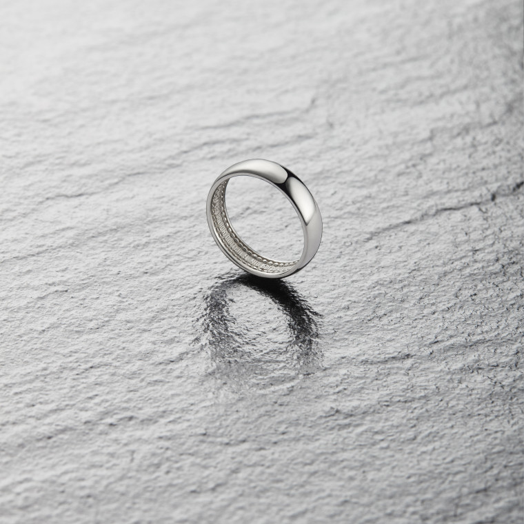Wide ring bearing the words “And two will become one flesh” 